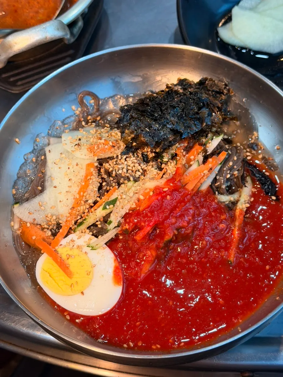 Cold buckwheat noodles in bright red sauce