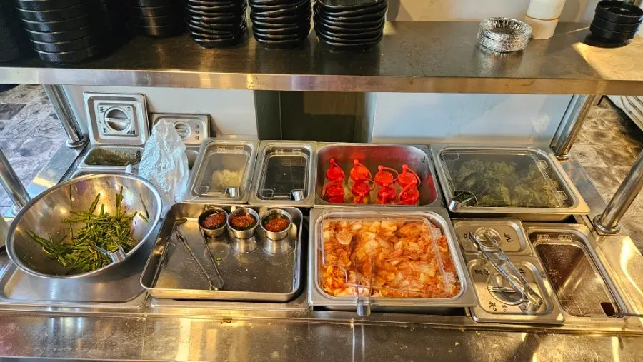 Vegetables and sauces brought from the self-serve bar