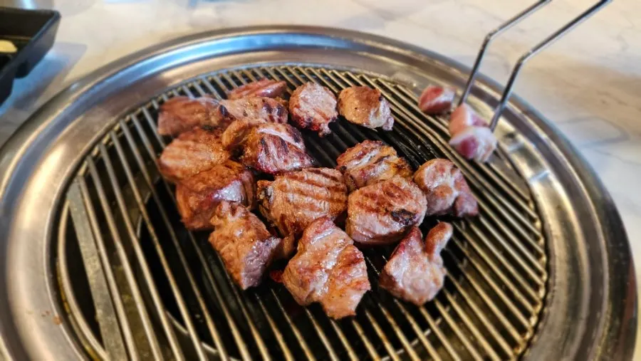 Grilled pork neck served cut into thick pieces