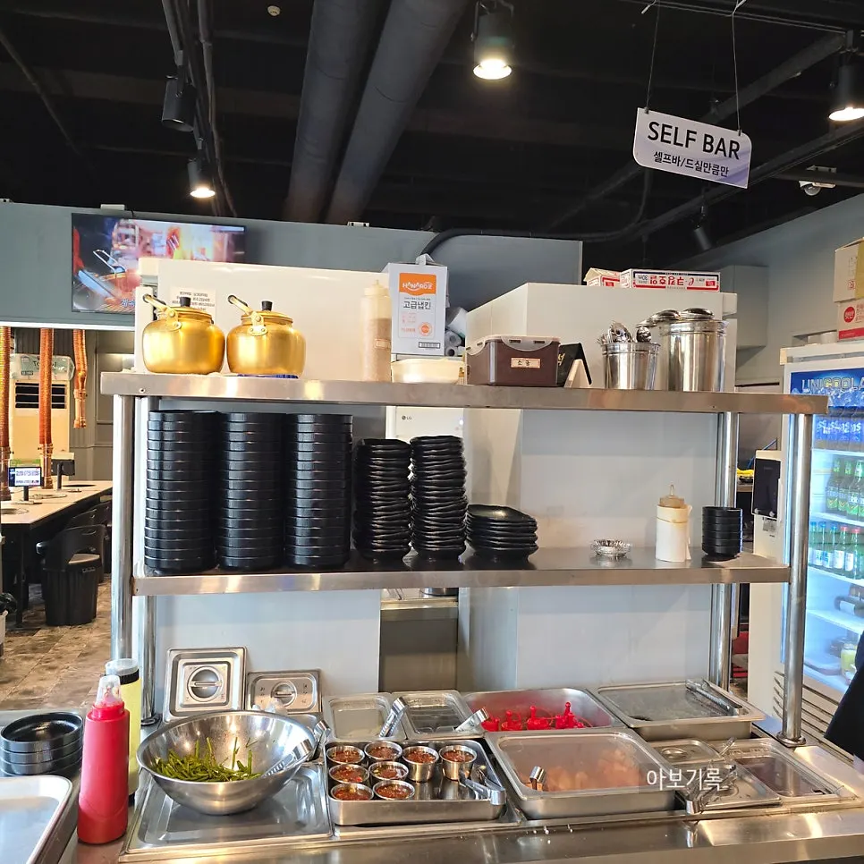 Self-serve side dish bar at the center of the restaurant