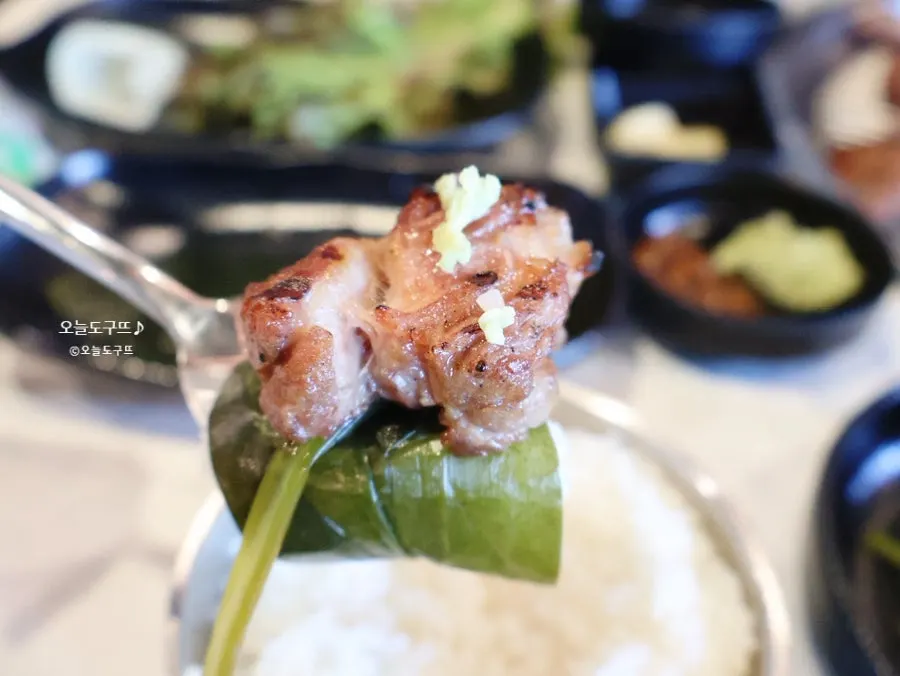 A piece of black pork on wild garlic leaf