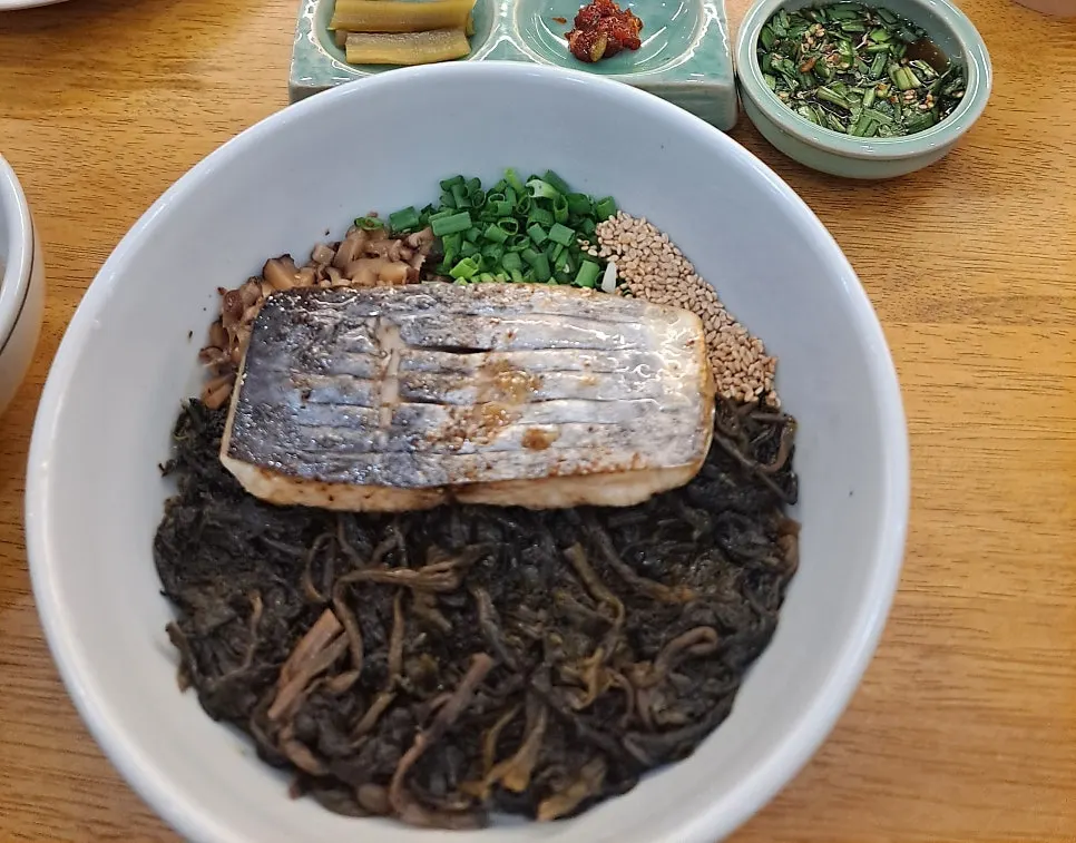Table set with three rice bowls and side dishes