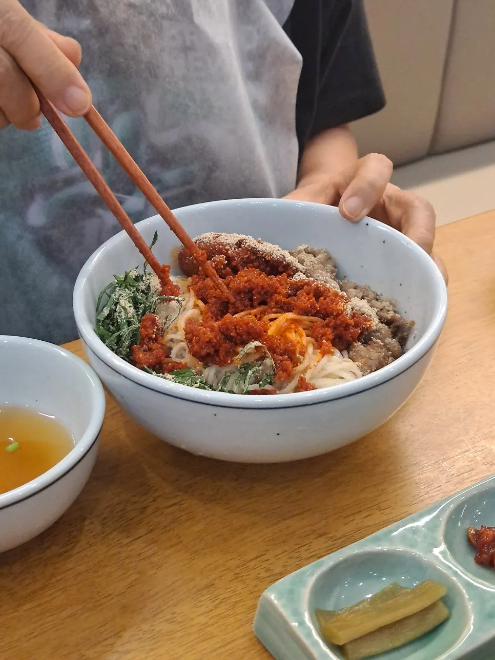 Chopsticks placed for scale next to the food