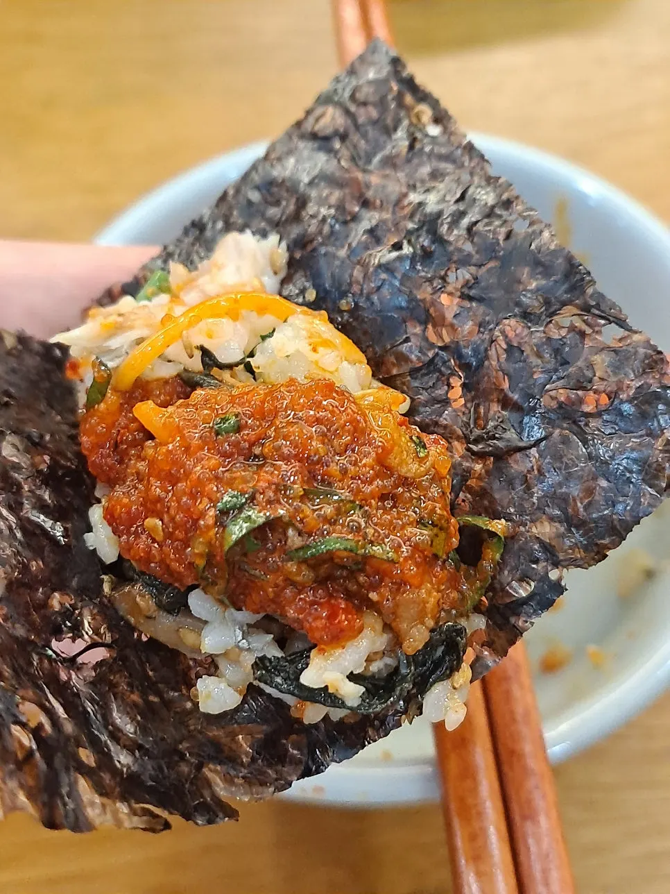 Herring roe scooped onto mackerel gondre rice