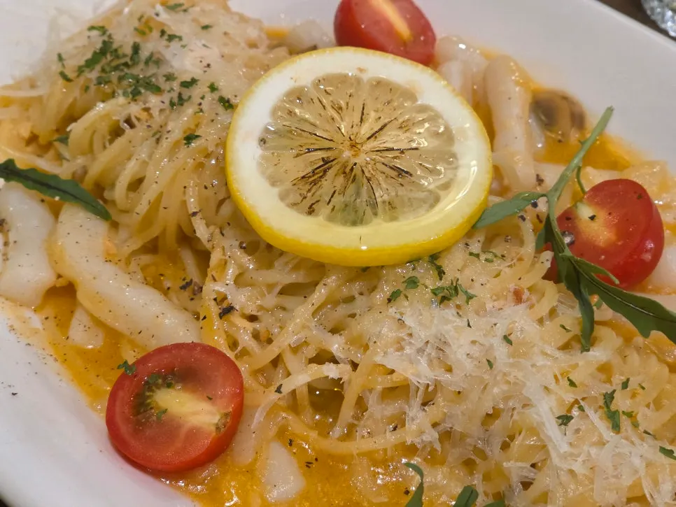 Noodles twirled and picked up with squid