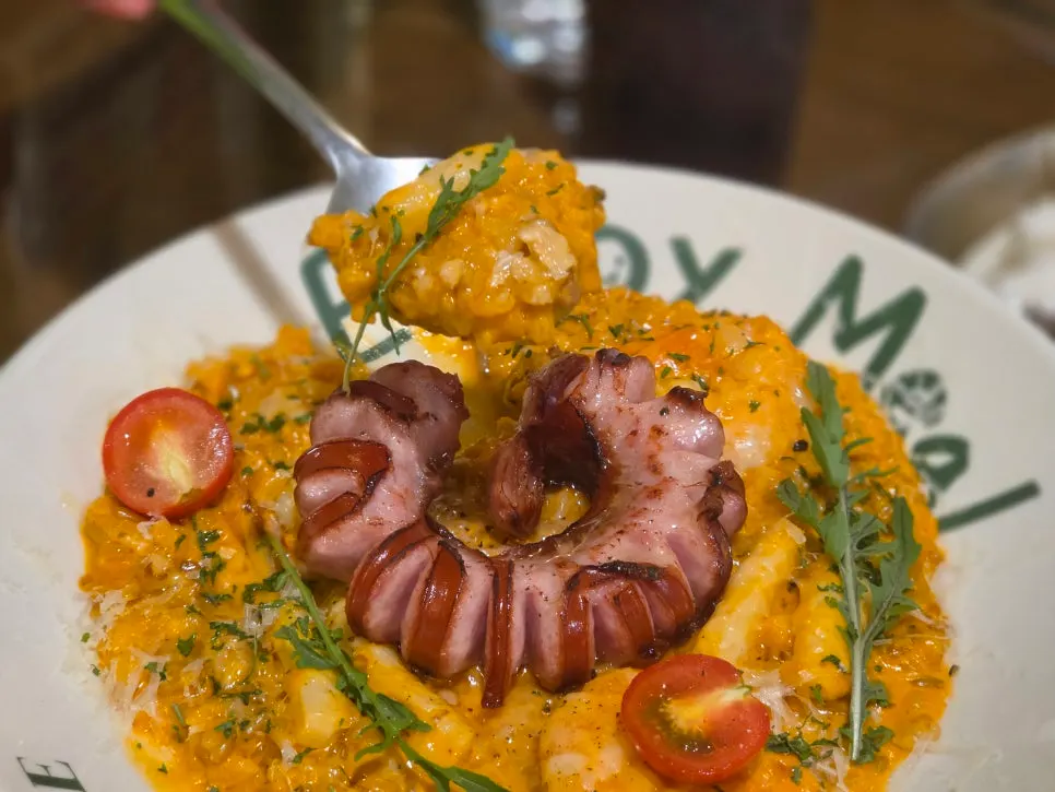 A spoonful of jambalaya risotto with rice and barley
