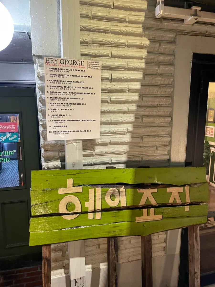 Menu and price sign posted outside Hey Joji