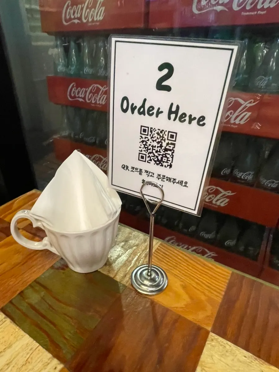 QR code menu sign at Hey Joji