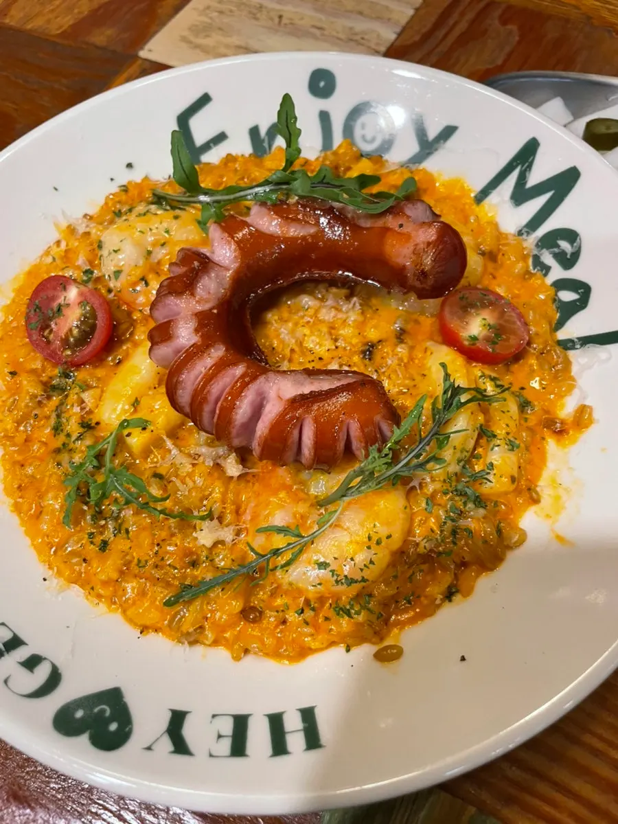Jambalaya rosé risotto topped with shrimp and sausage