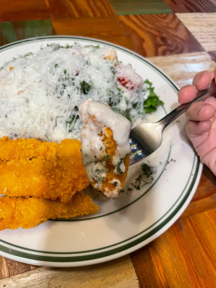 Cross-section of a crispy-outside, juicy-inside chicken tender
