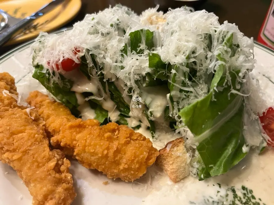 Chicken tender salad with vegetables stacked upright in layers