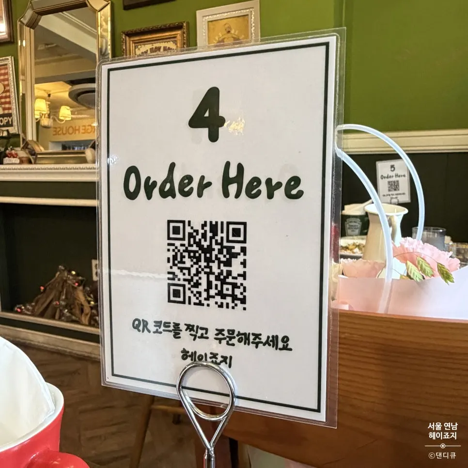 QR mobile ordering sign on a table at Hey Joji