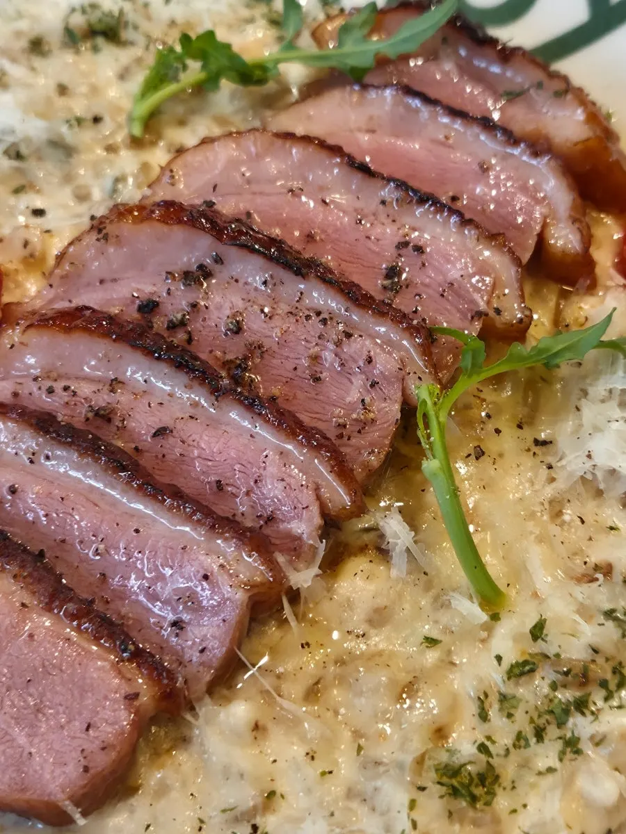 Duck meat topping the risotto
