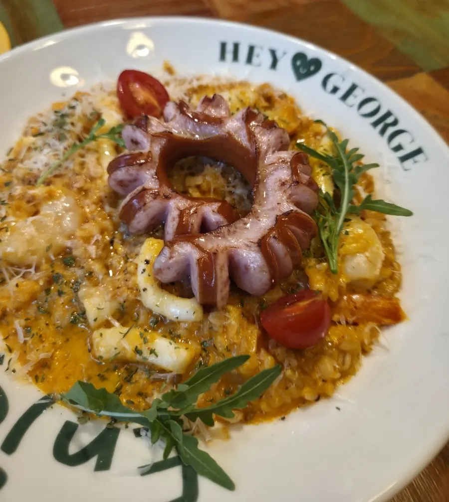 Jambalaya rosé risotto served at a nearby table