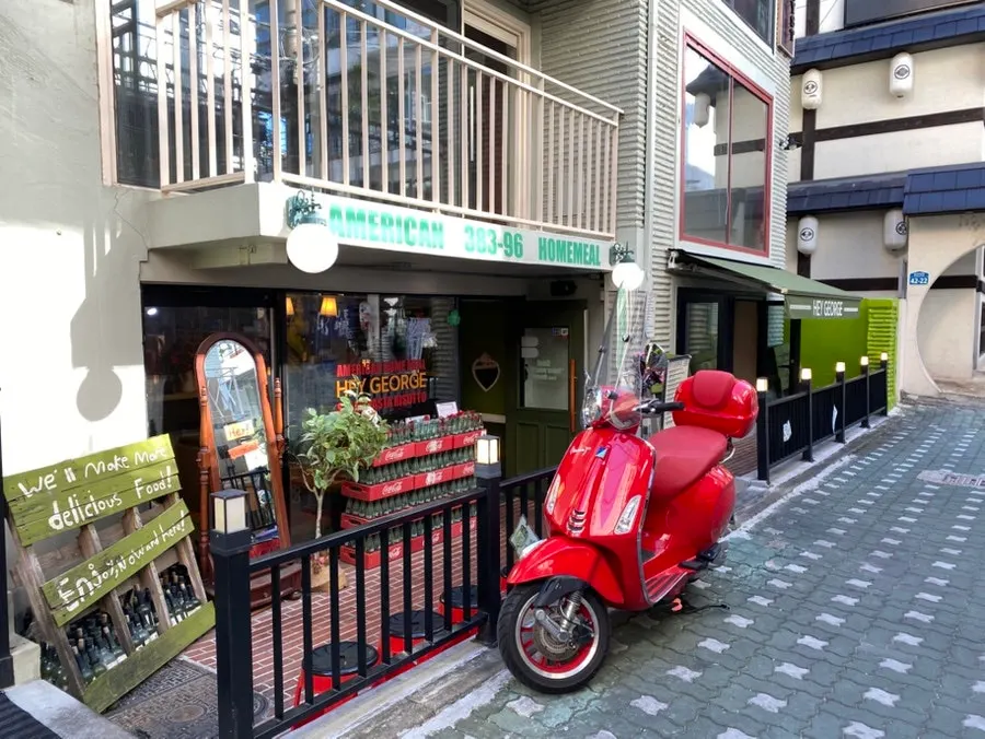 Street view with the entrance to Hey Joji visible