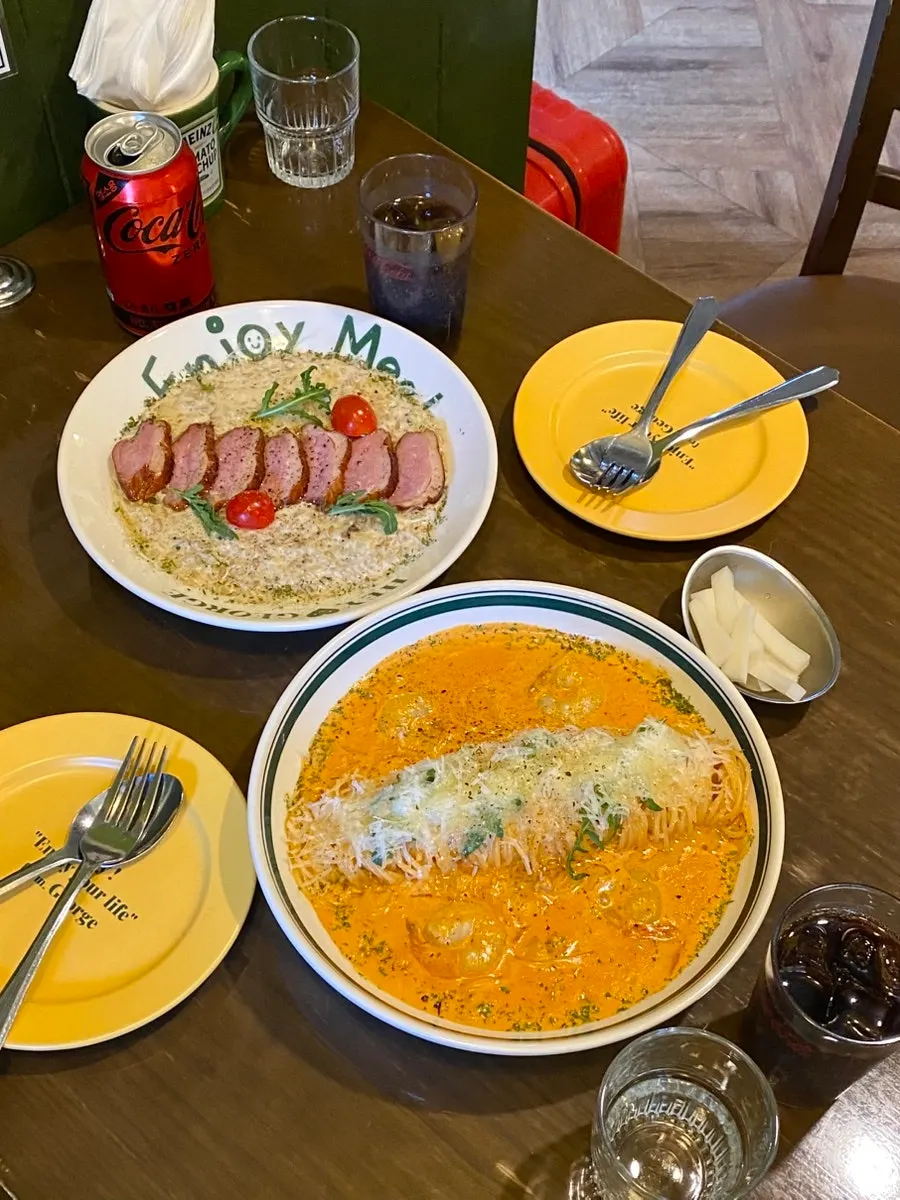 Large bowls of pasta and risotto served together on the table