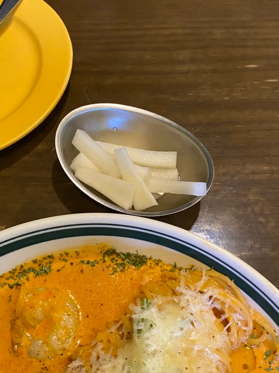 A side dish of pickled radish served with the meal