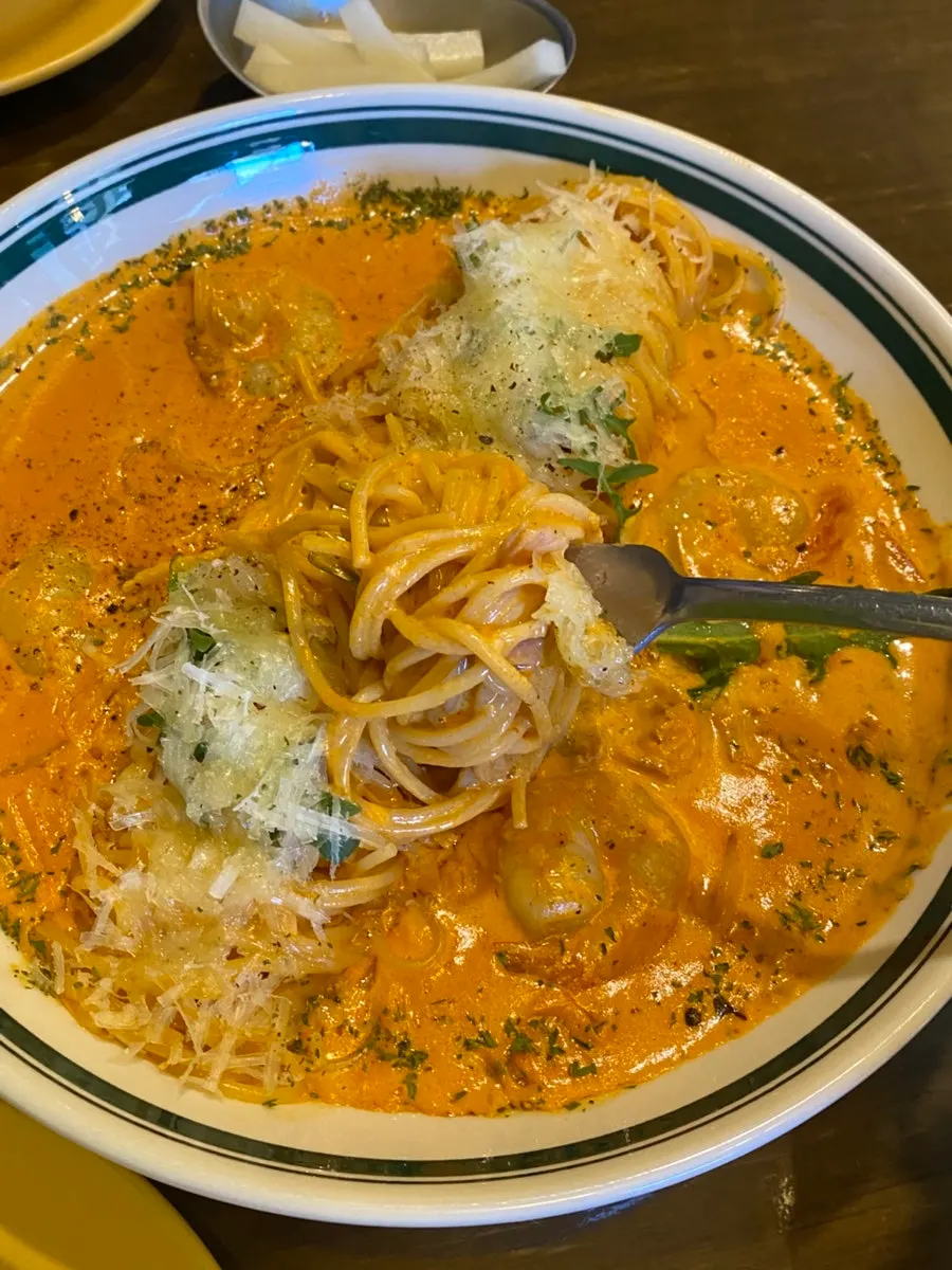 A forkful of the rich rosé pasta noodles lifted up