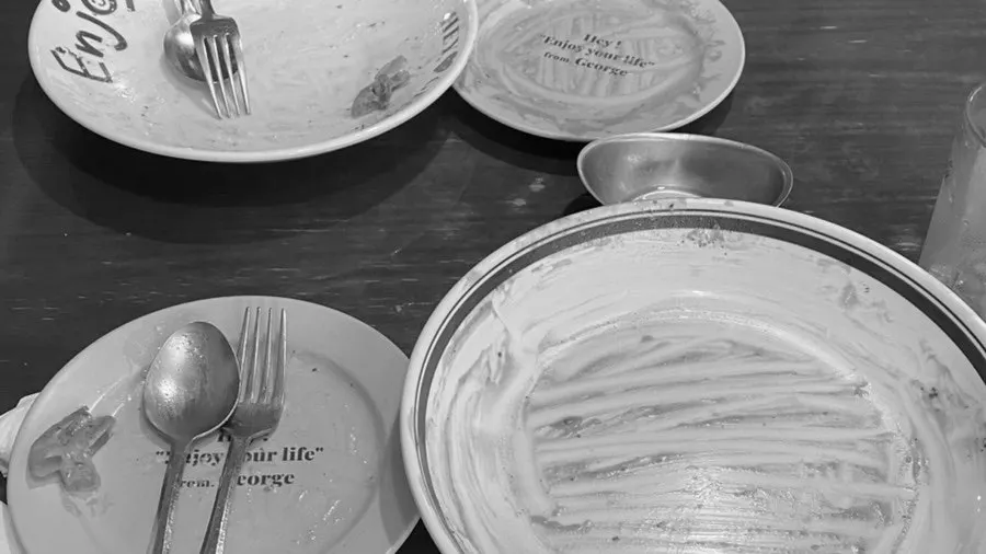 Empty bowls of pasta and risotto, sauce all scraped clean