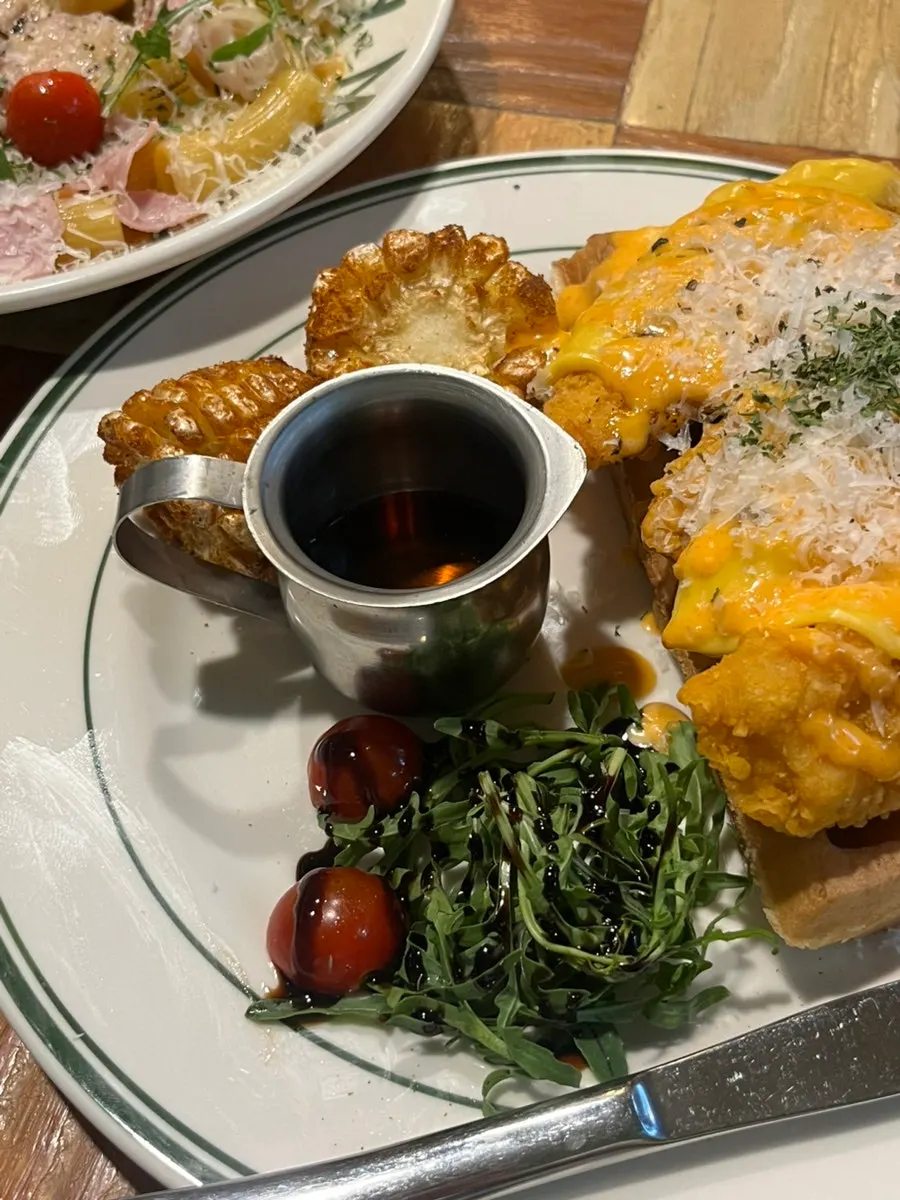 Waffle chicken drizzled with maple syrup