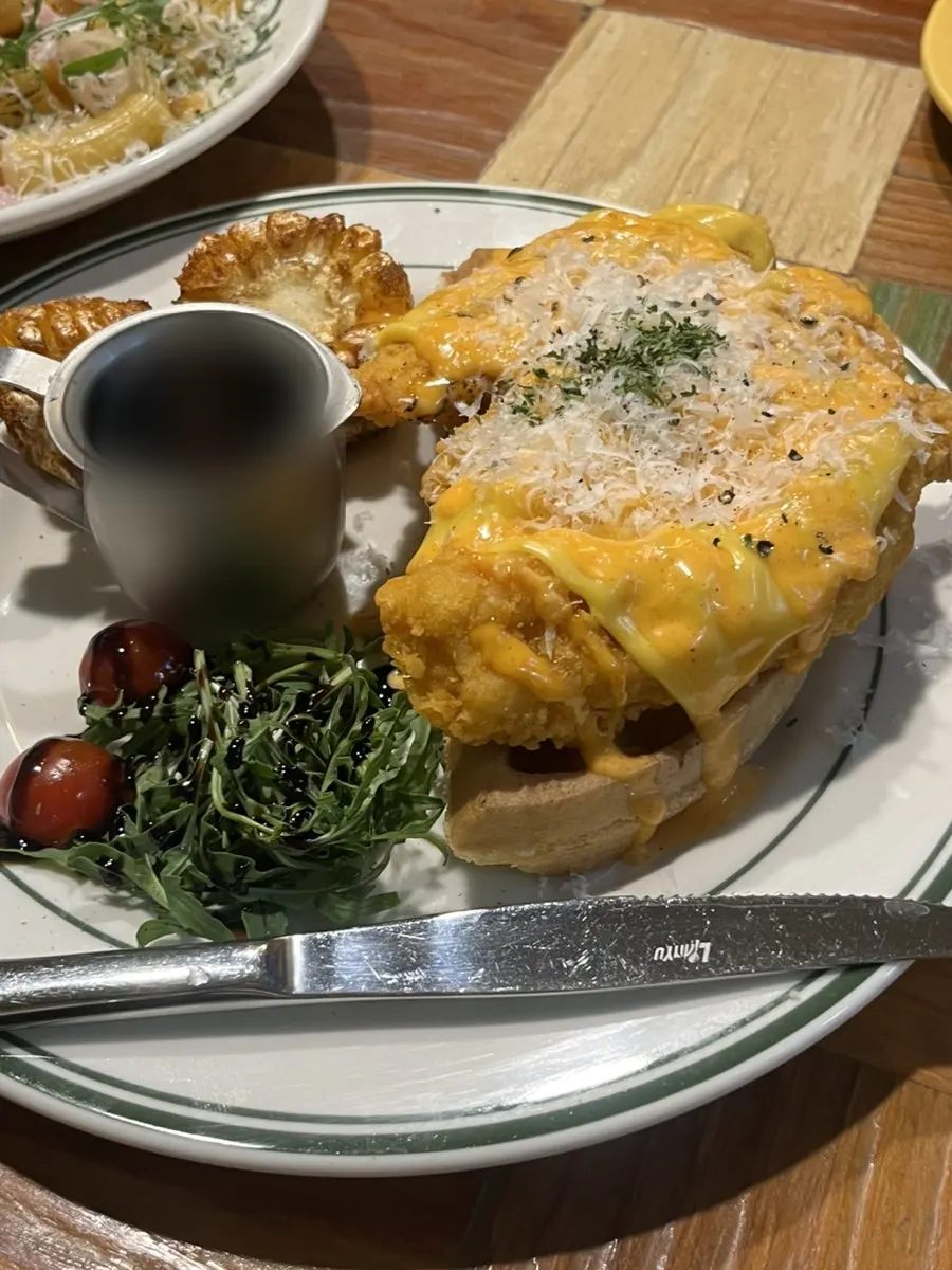 Close-up of waffle chicken cut into bite-size pieces