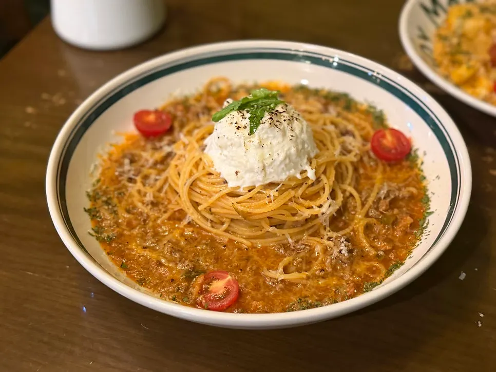 Tomato pasta plating decorated with cherry tomatoes