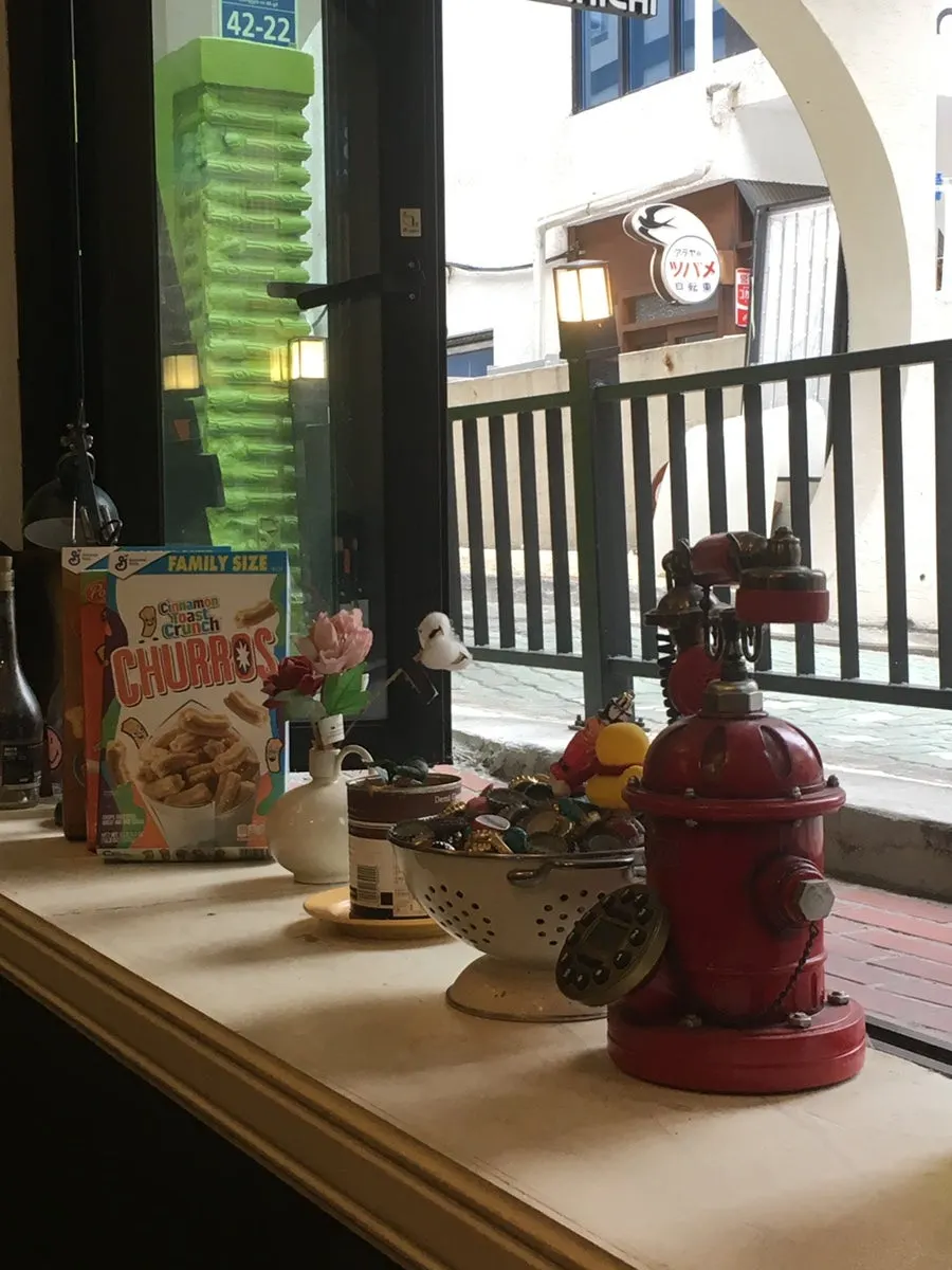 A corner of the restaurant with warm lighting and small objects