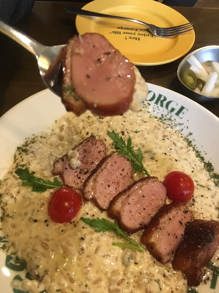 Cream risotto topped with duck steak