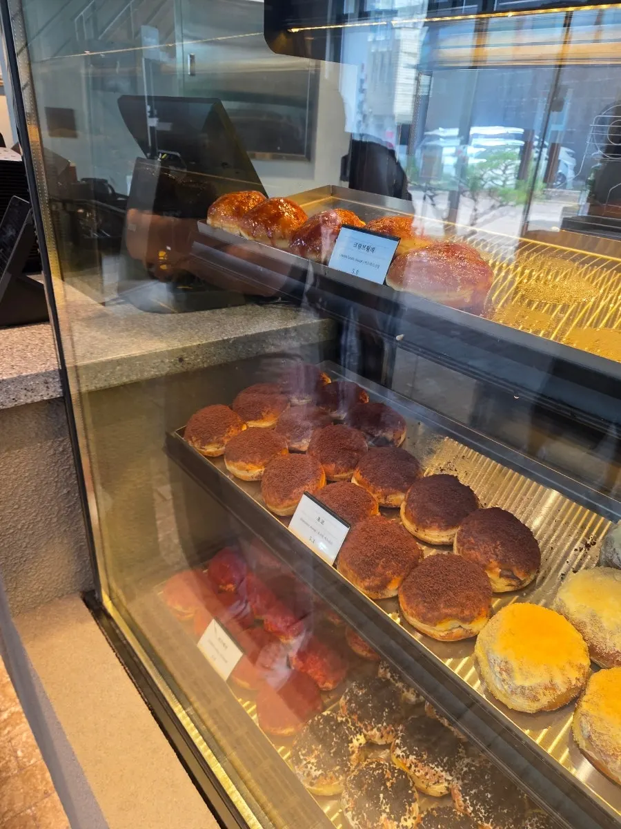 Donut display shelf ready for takeout at Heuksadang