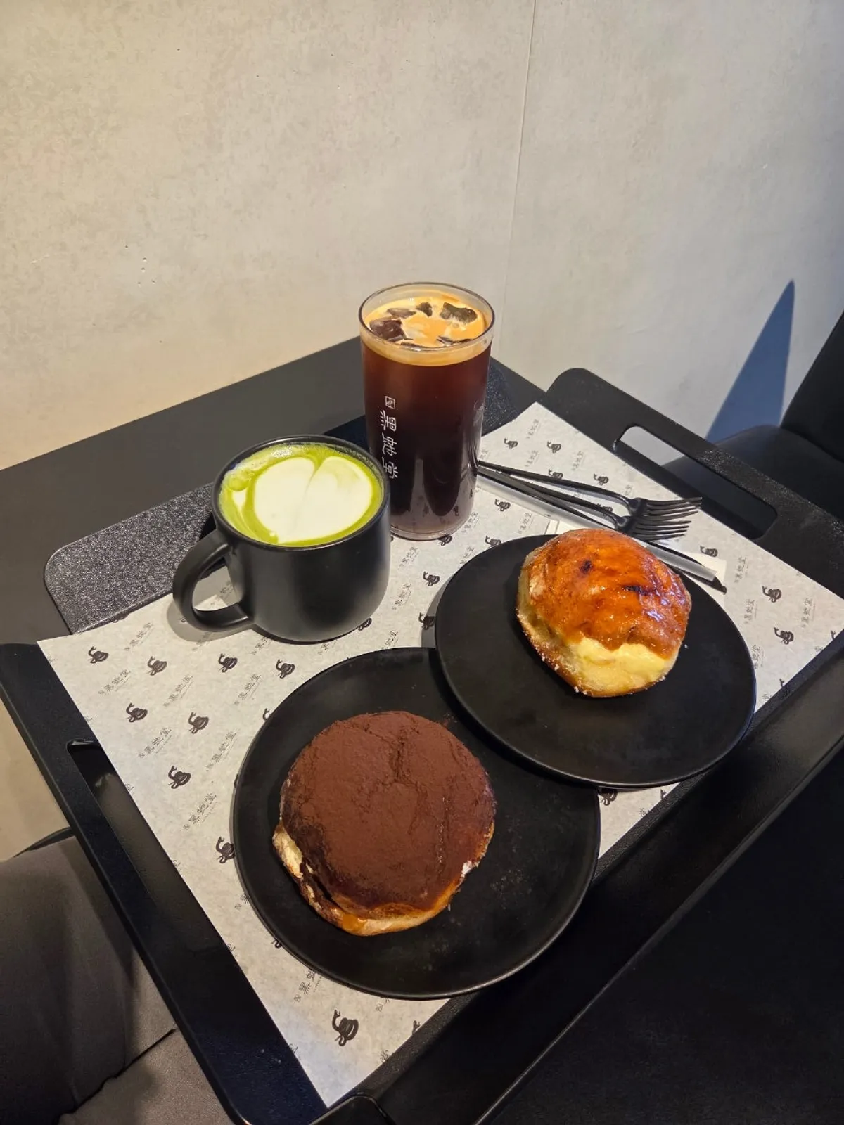 Heuksadang tiramisu donut and cream donut on a plate
