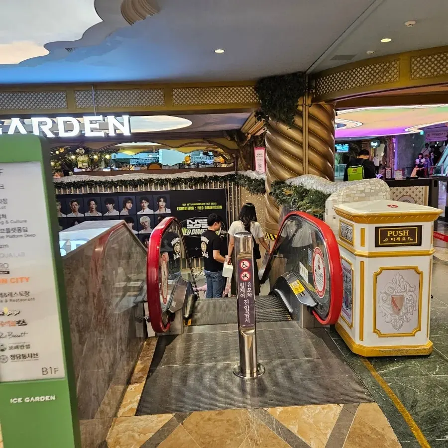 Escalator leading down under the Ice Garden sign