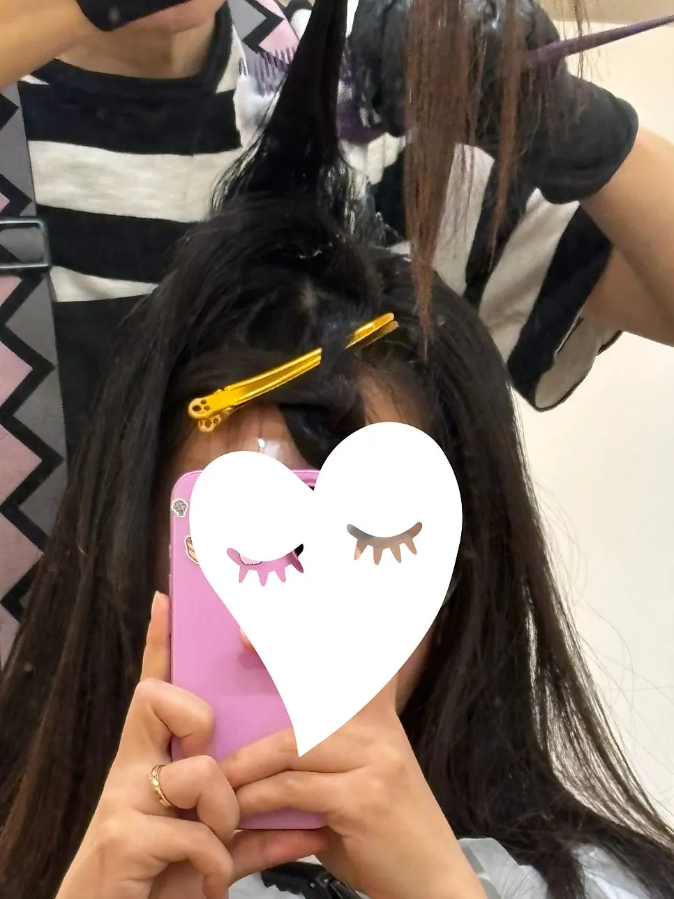 Rolling the front and side hair while applying root magic straightening