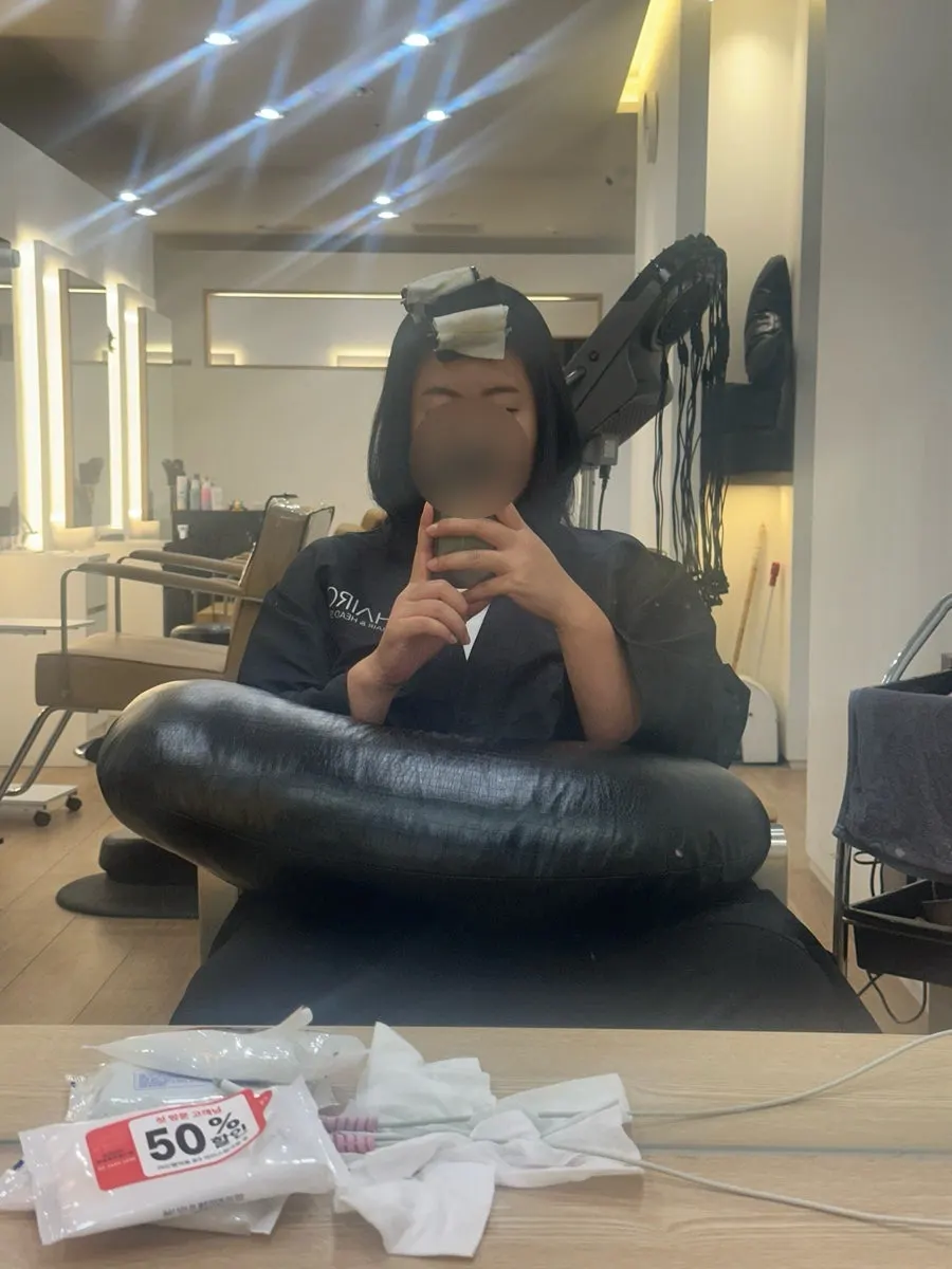 Straightening hair with an iron press