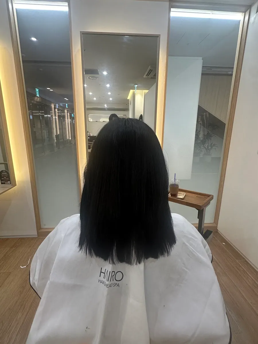Back view of the finished blow-dried volume magic hair