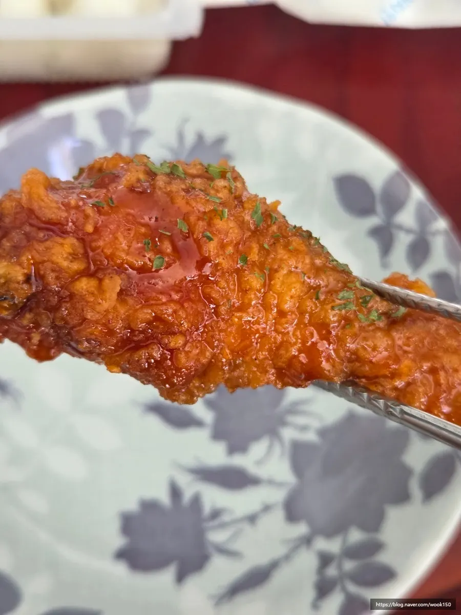 Seasoned chicken coated generously in sauce