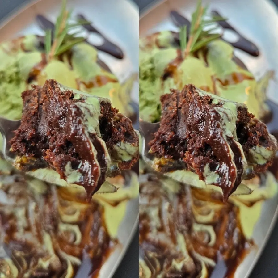 Chocolate matcha brownie topped with matcha ice cream