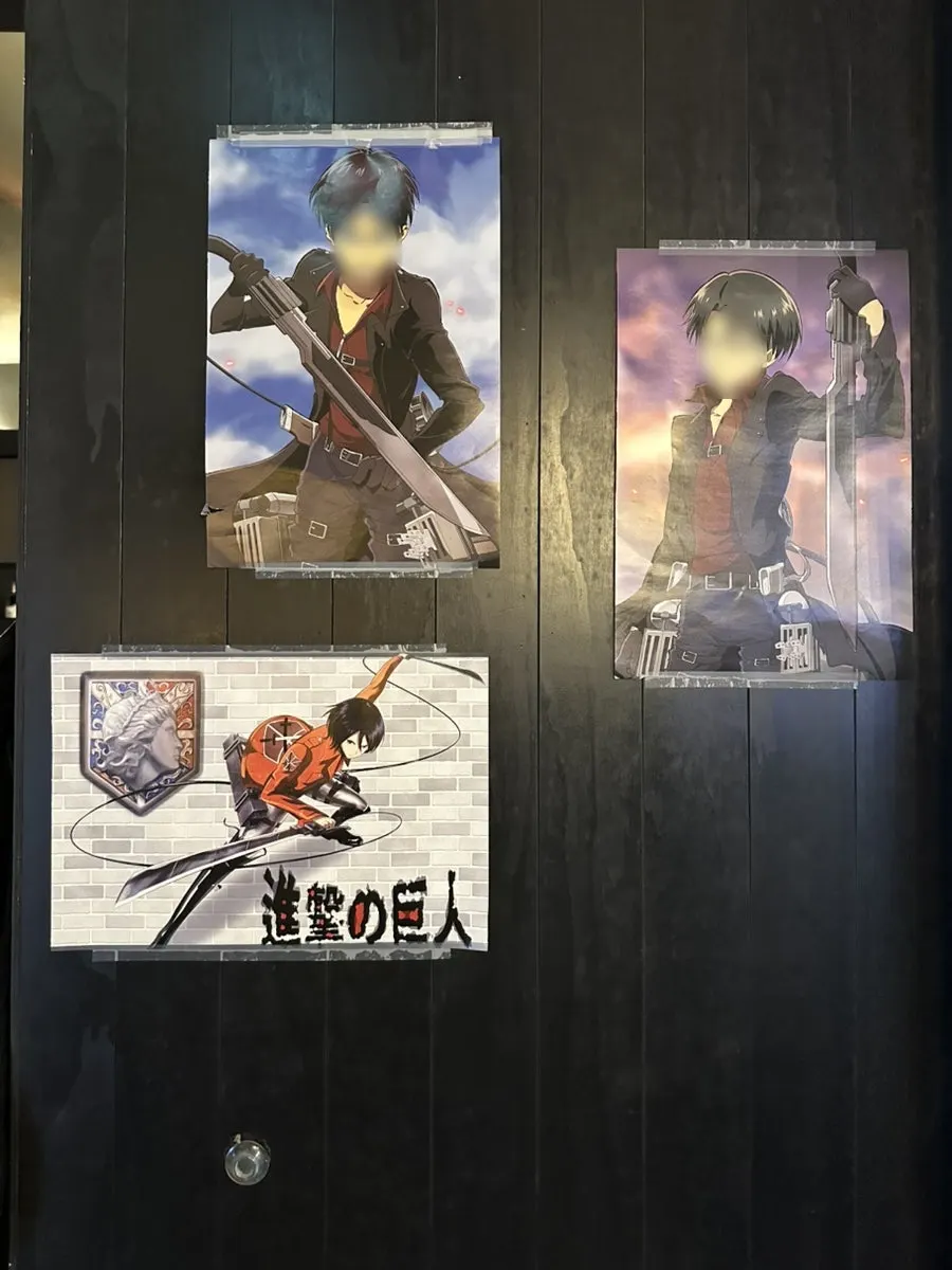 Japanese anime posters on Hiku's wall