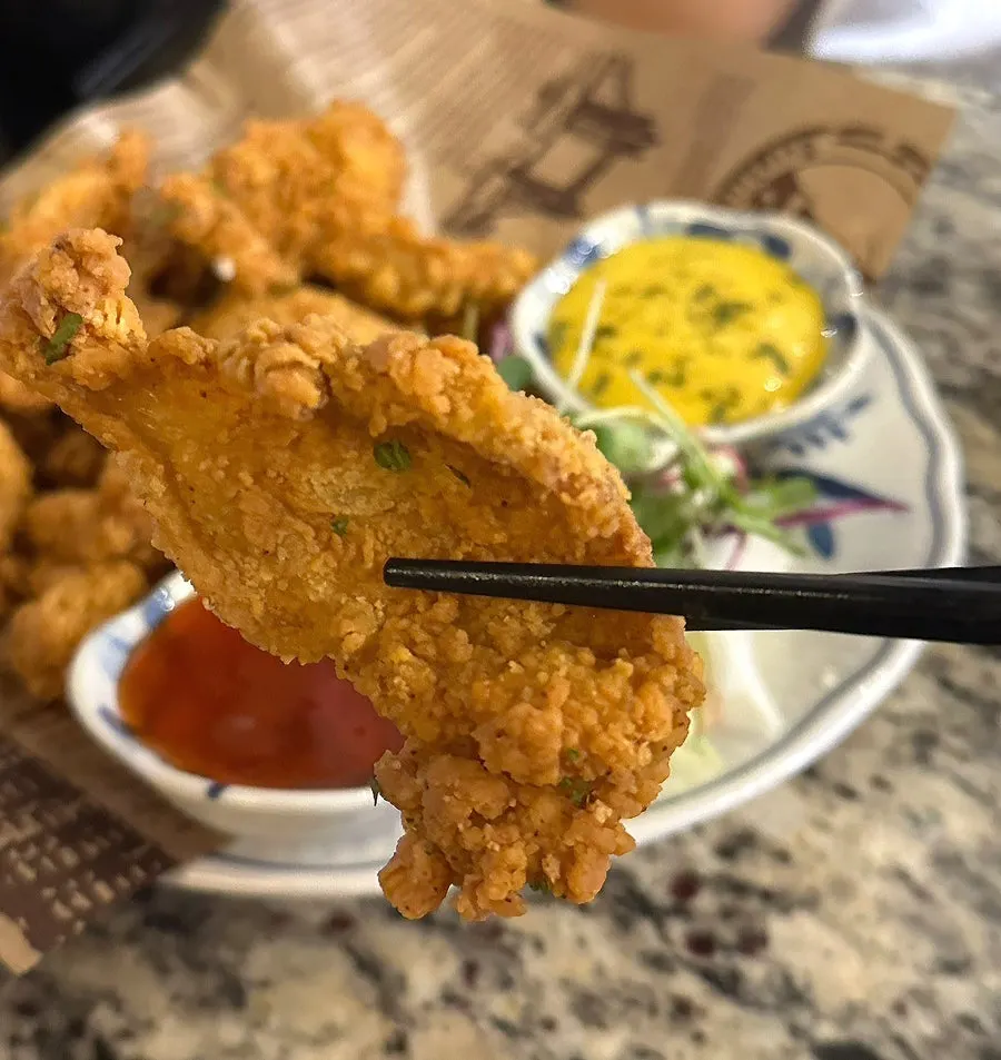 Chicken skin served with yellow sauce