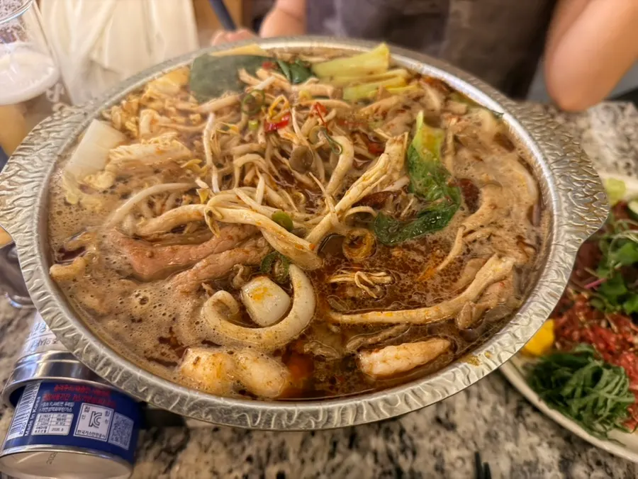 Sichuan beef brisket mala hot pot bubbling on the burner