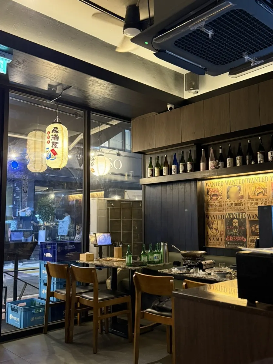 Wood and black mood interior space at Hiku