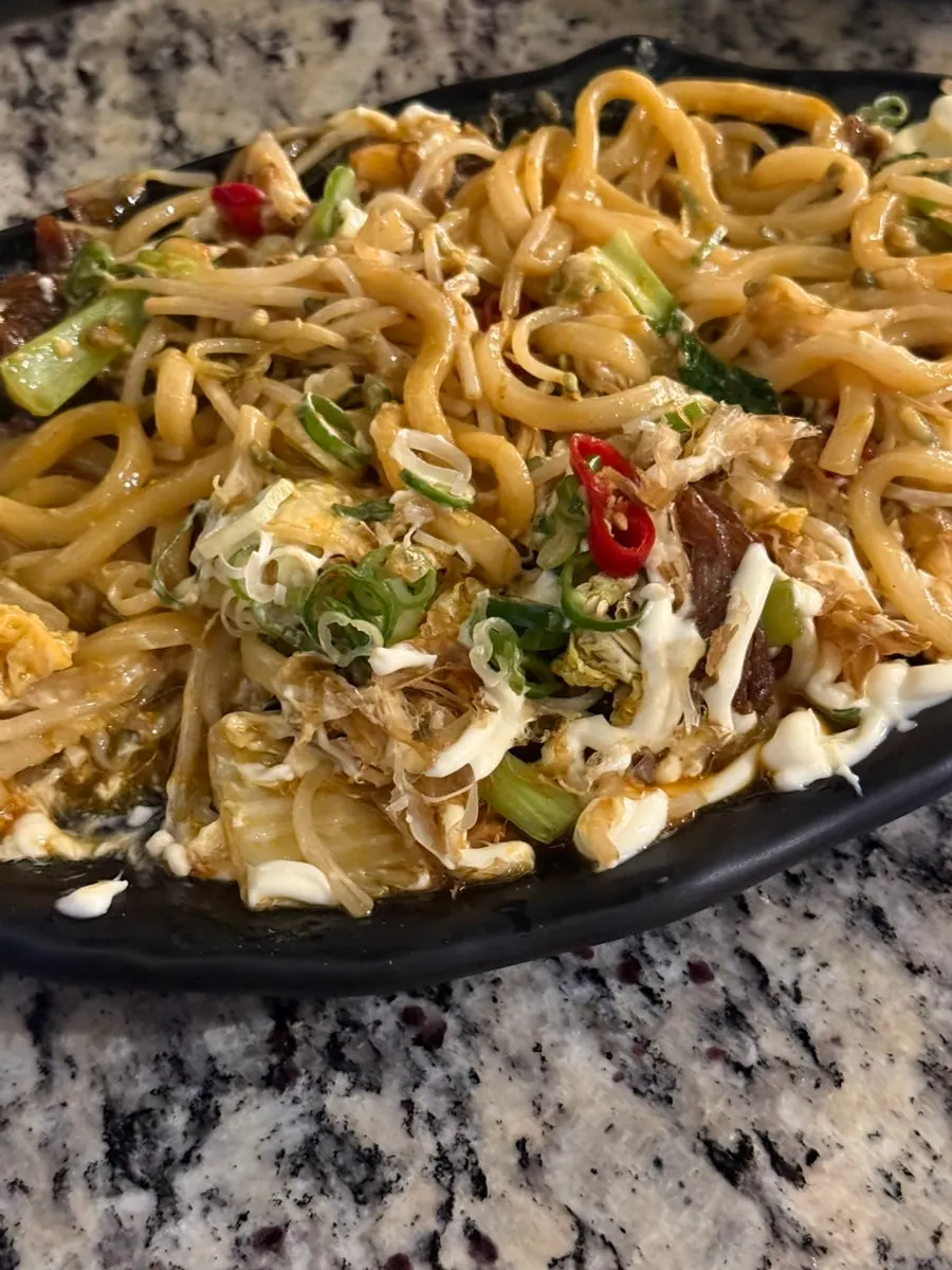 Close-up of chadol beef mixed with udon noodles