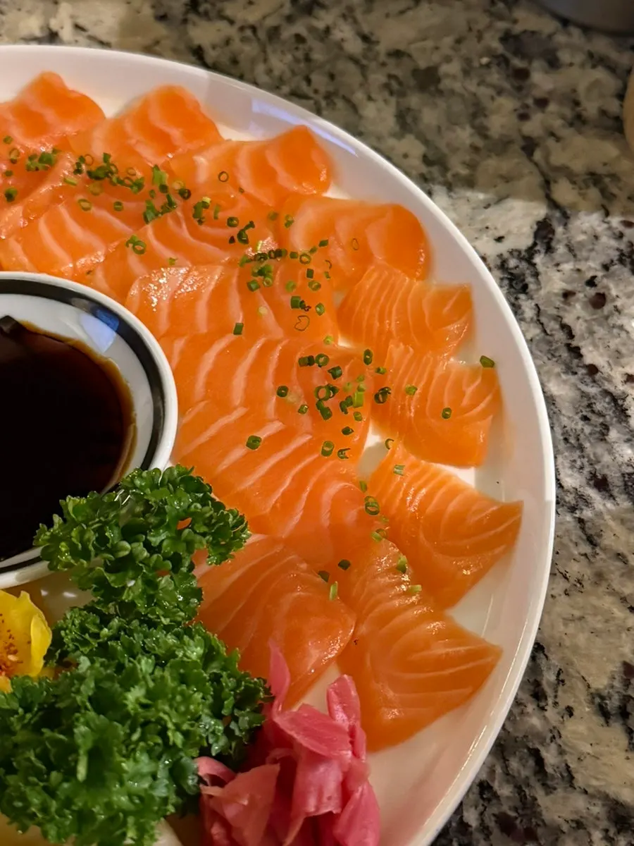 Close-up of a single piece of raw salmon sashimi