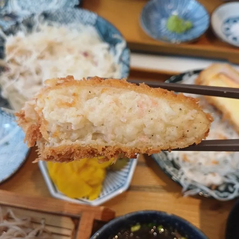 Crab croquette cut in half showing the inside
