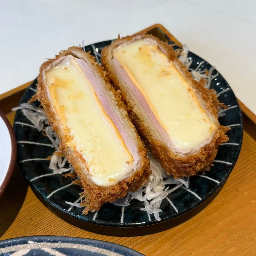 Dipping hire katsu into sauce