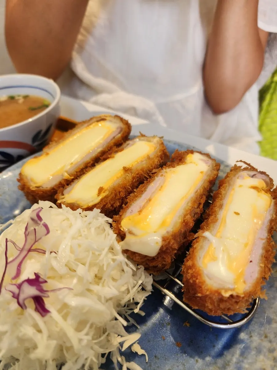 Cheese stretching long from the cheese katsu