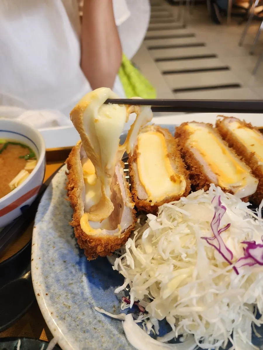 Close-up of cheese katsu cross-section