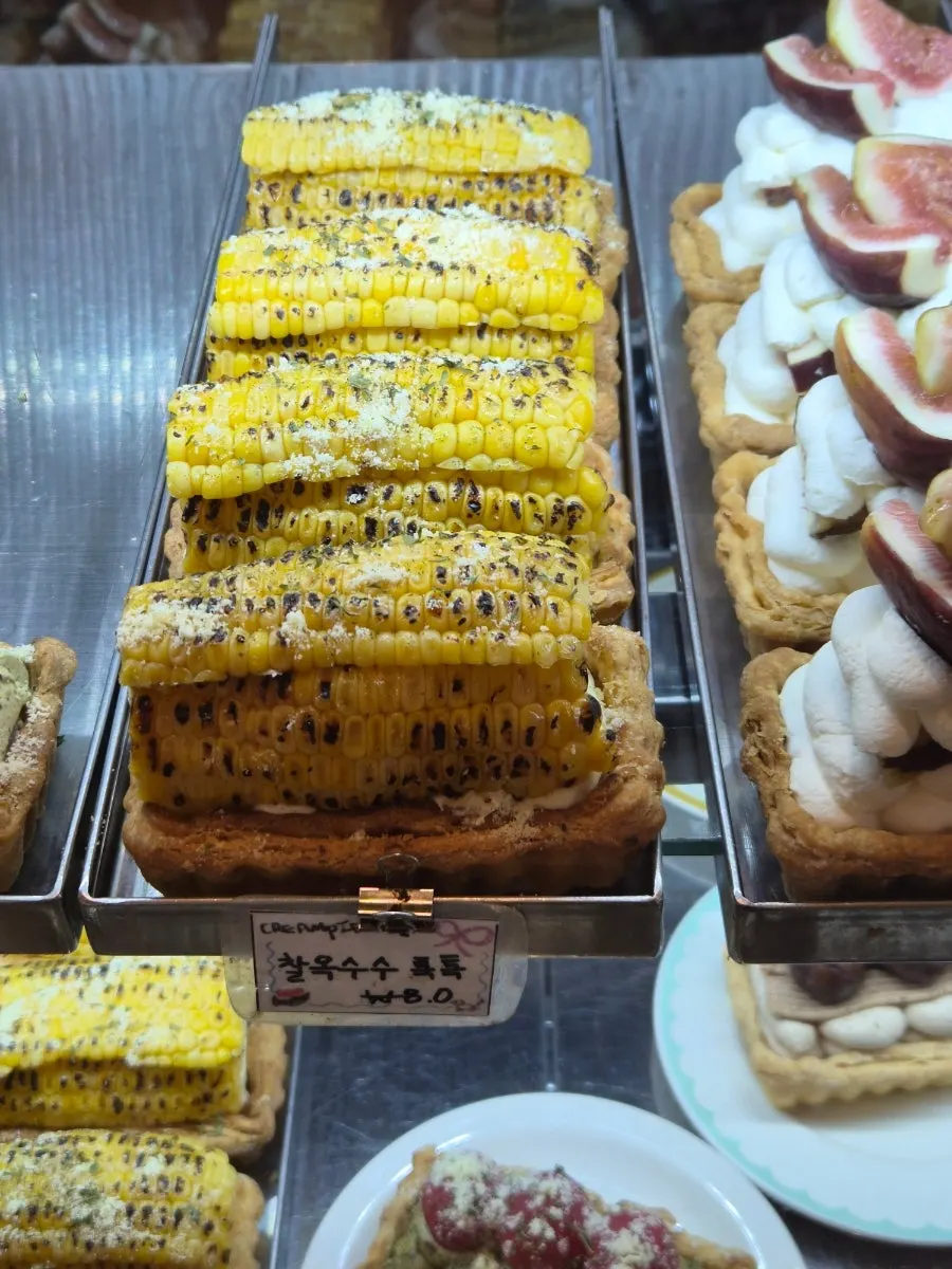 Showcase of cream pies including basil tomato pie