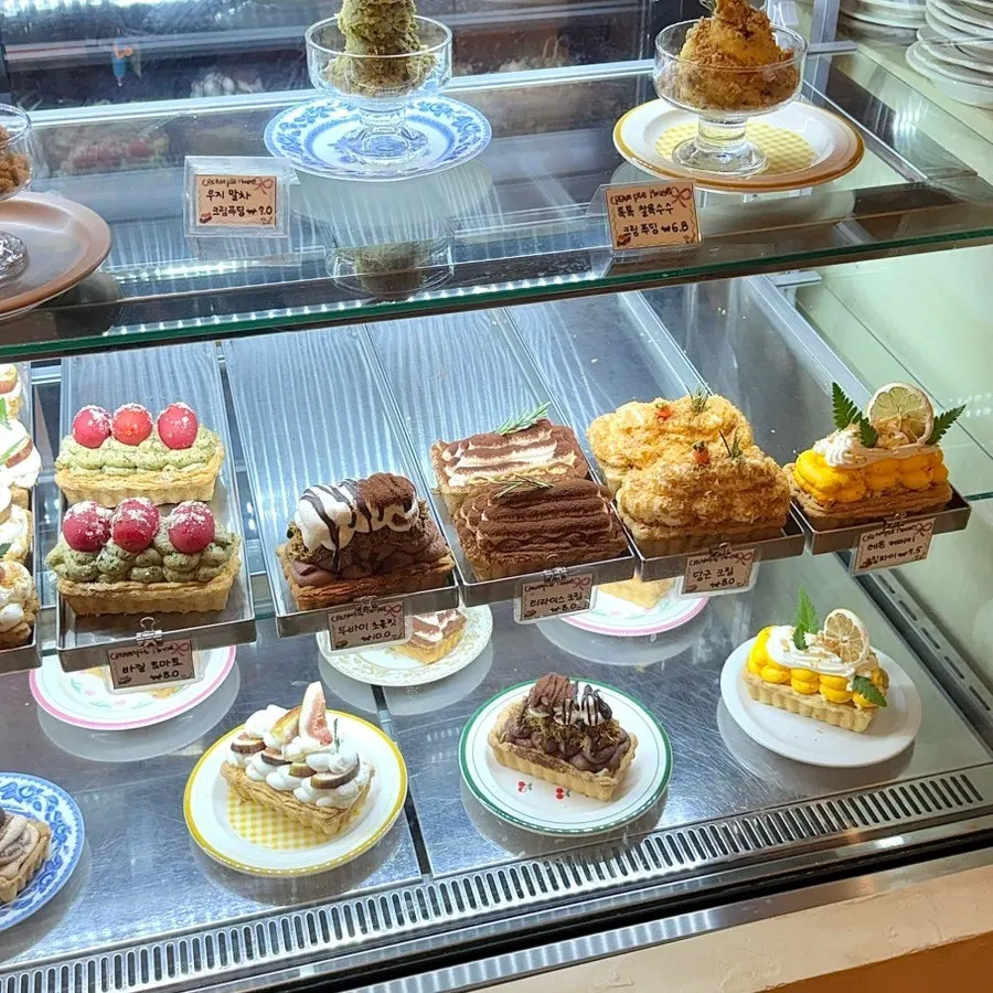 Showcase displaying various cream pies