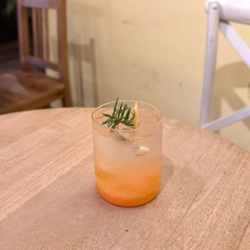 Peach ade with peach syrup layered at the bottom