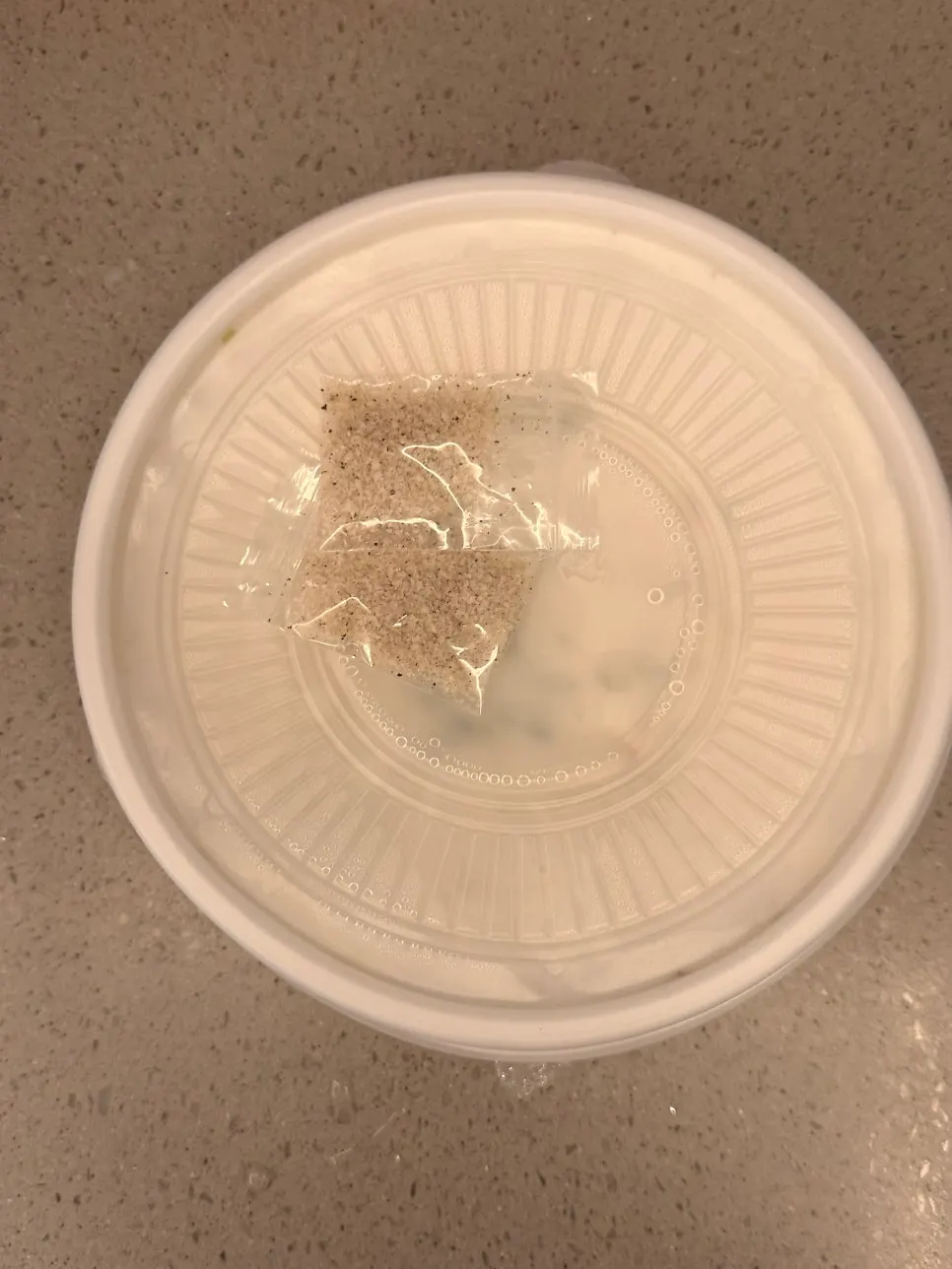 Takeout containers of the ordered Korean dishes